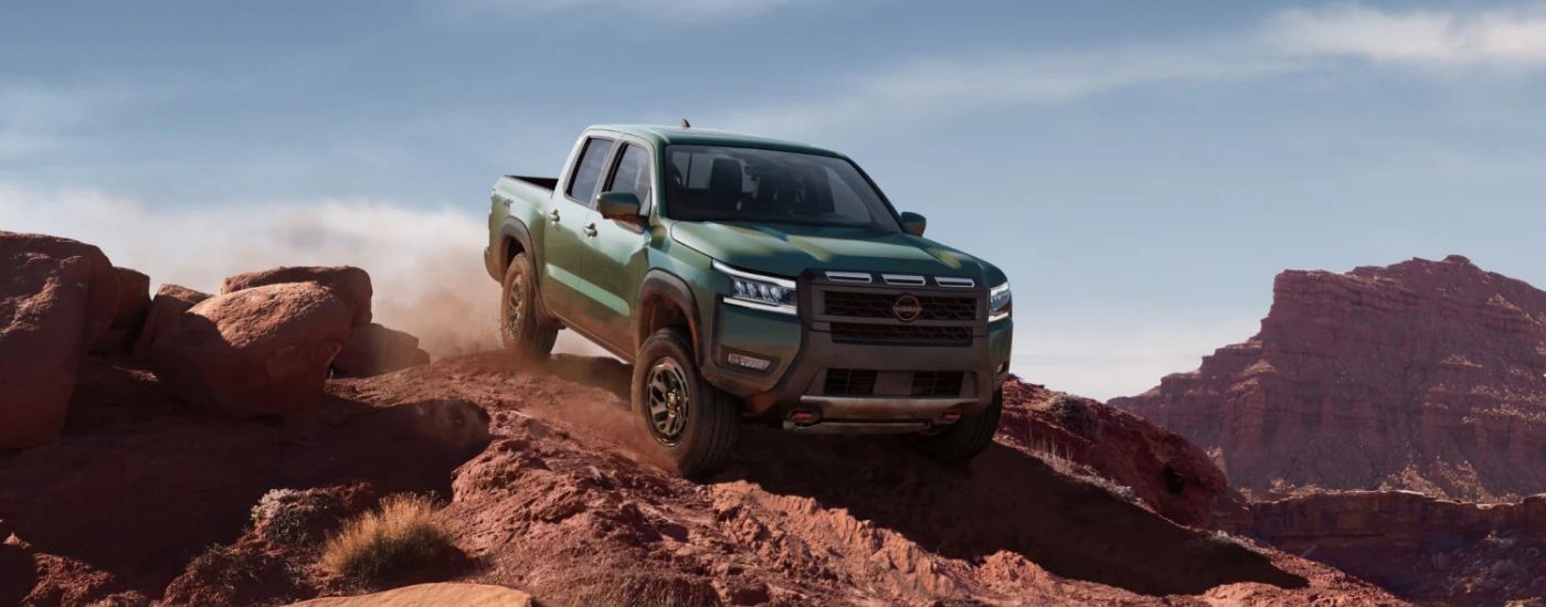 Green 2025 Nissan Frontier PRO-4X off-roading