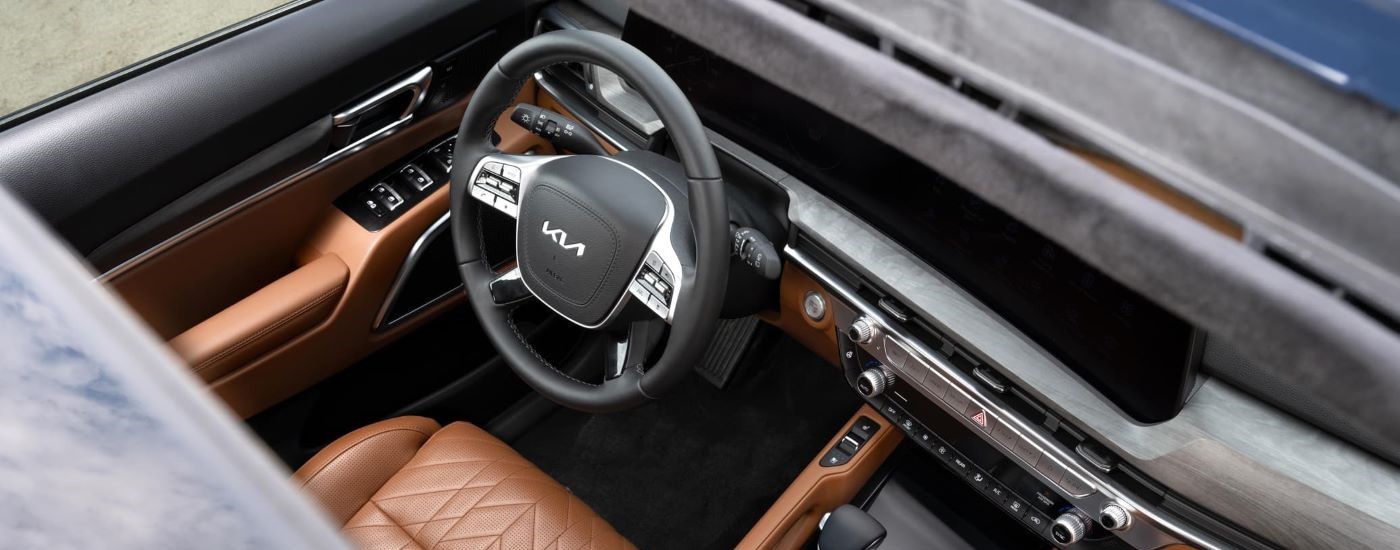Brown leather seating and center console in a 2025 Kia Telluride for sale near Golden Valley