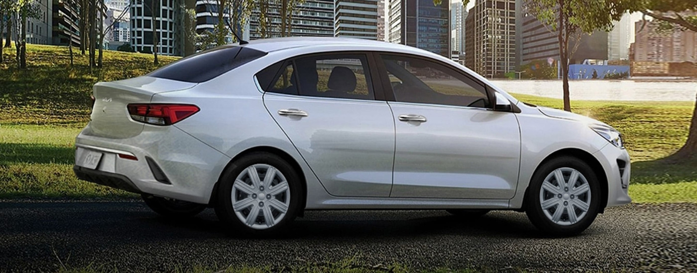 Silver 2023 Kia Rio parked on a path