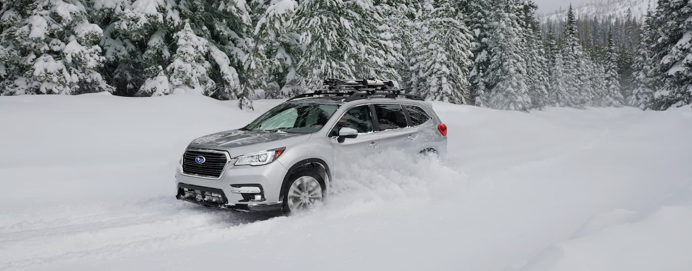 Silver 2020 Subaru Ascent Limited driving to a Subaru dealer near you