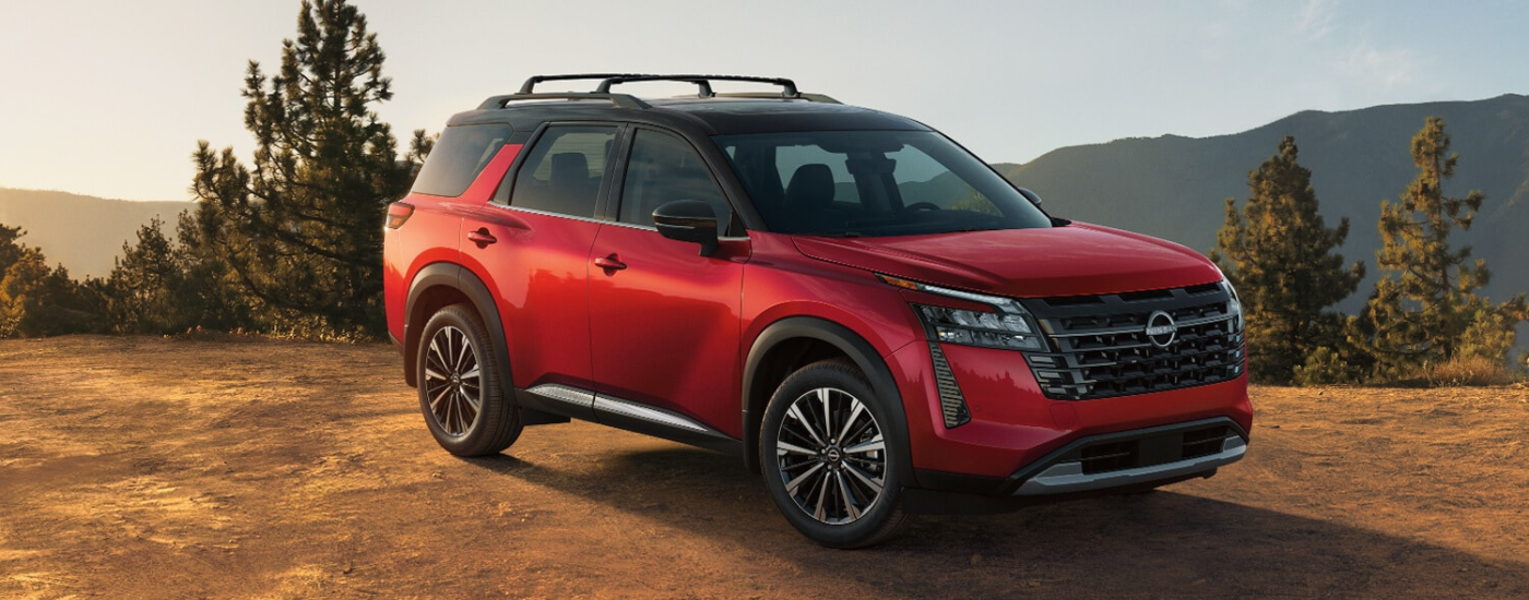 Red 2026 Nissan Pathfinder parked off-road