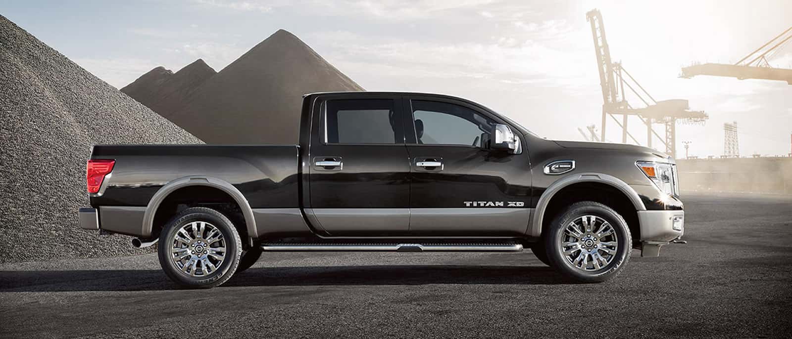 Black Nissan Titan XD pickup truck side profile