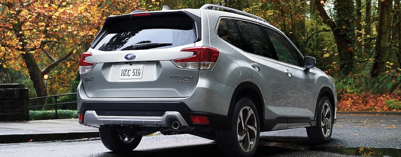 Silver 2023 Subaru Forester Touring parked on pavement