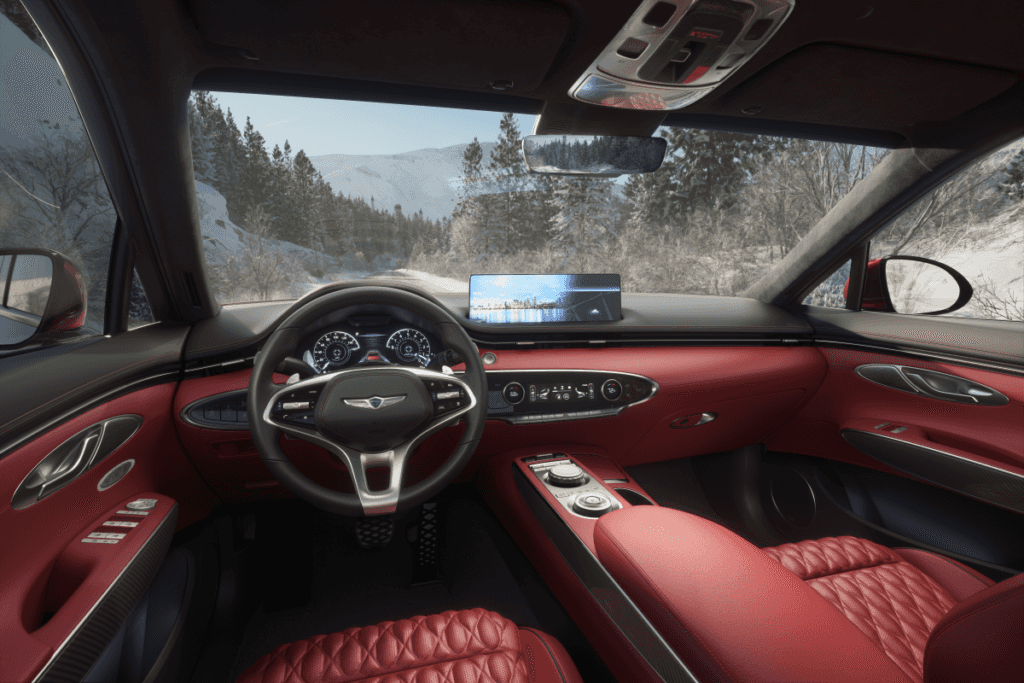 Interior view of a Genesis Electrified GV70 driving on a snowy road