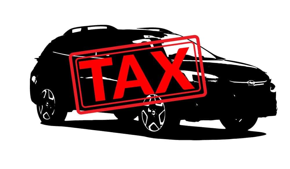 Tax stamp over a black SUV silhouette