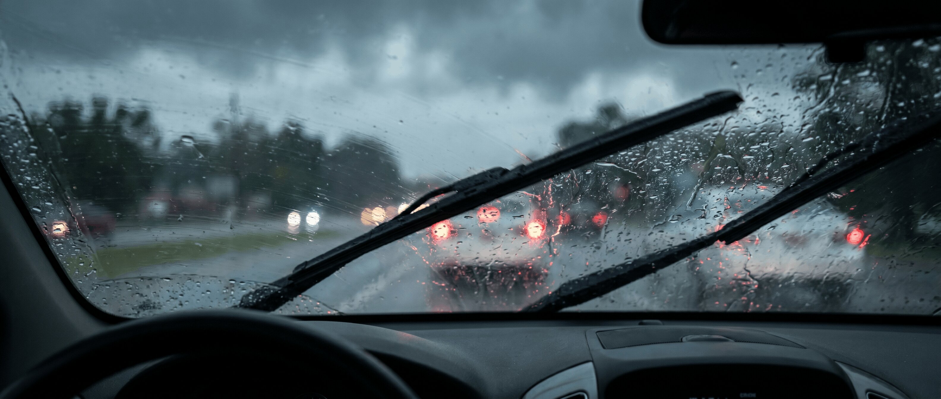 Windshield wipers clearing rain during storm in Roswell GA