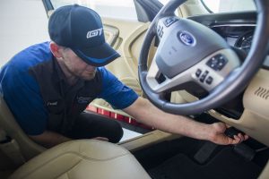 Ford technician upgrading an older Ford model