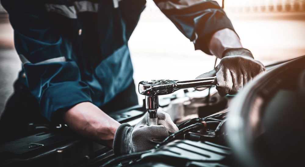 Technician servicing a vehicle