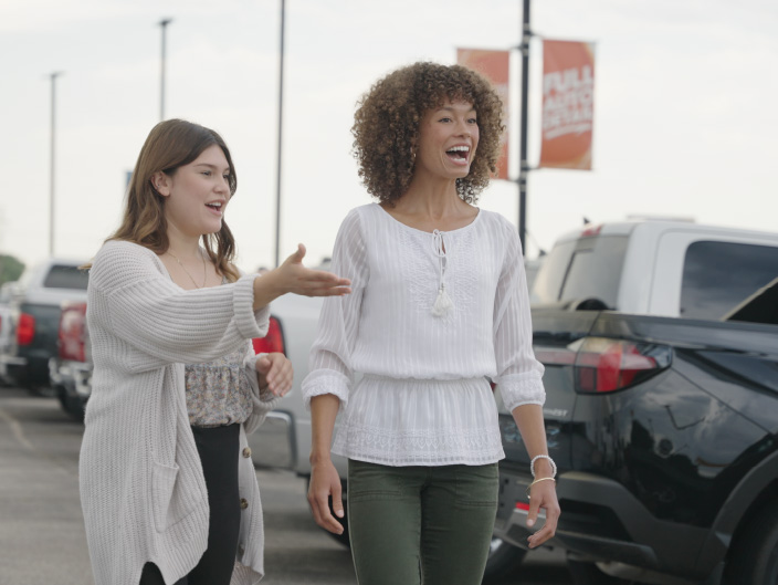 Customer Experience Advocate showing a customer new vehicles at Don Hattan Chevrolet