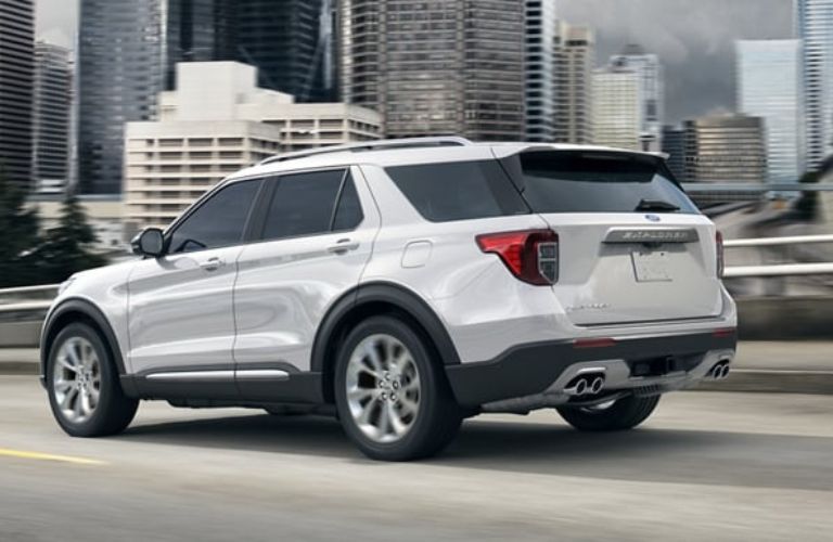 White 2024 Ford Explorer Platinum Rear Exterior on a Freeway