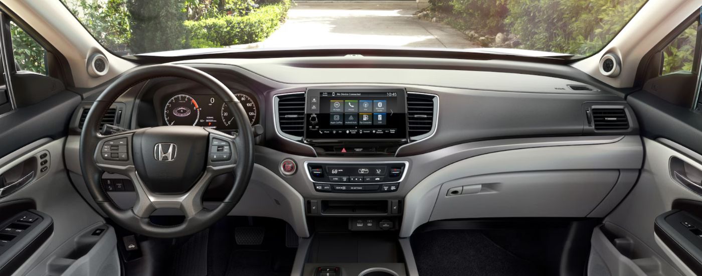 Interior view of a 2026 Honda Ridgeline infotainment system and gauge cluster. 