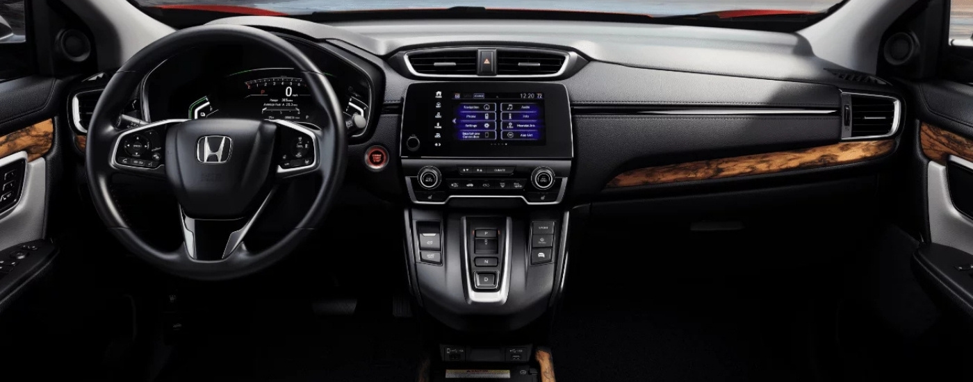 Steering wheel and infotainment screen are shown in a 2021 Honda CR-V Touring