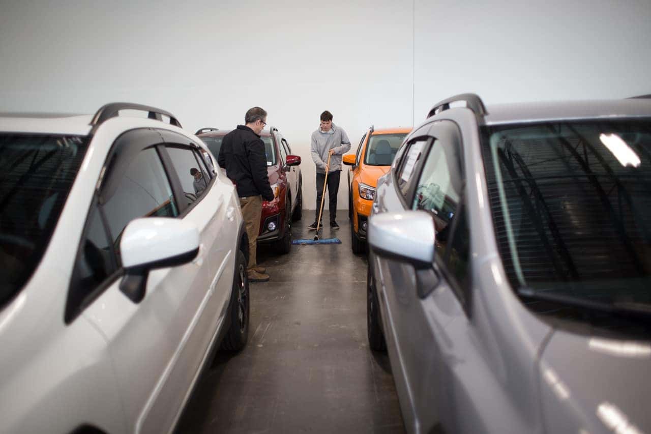 Victory Academy interns working at the dealership