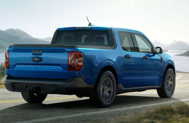 Blue 2025 Ford Maverick Rear Exterior on a Country Highway