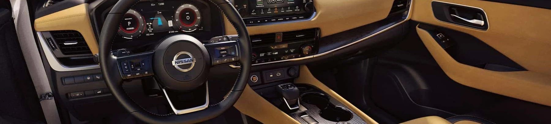 The black and tan leather interior of a 2021 Nissan Rogue