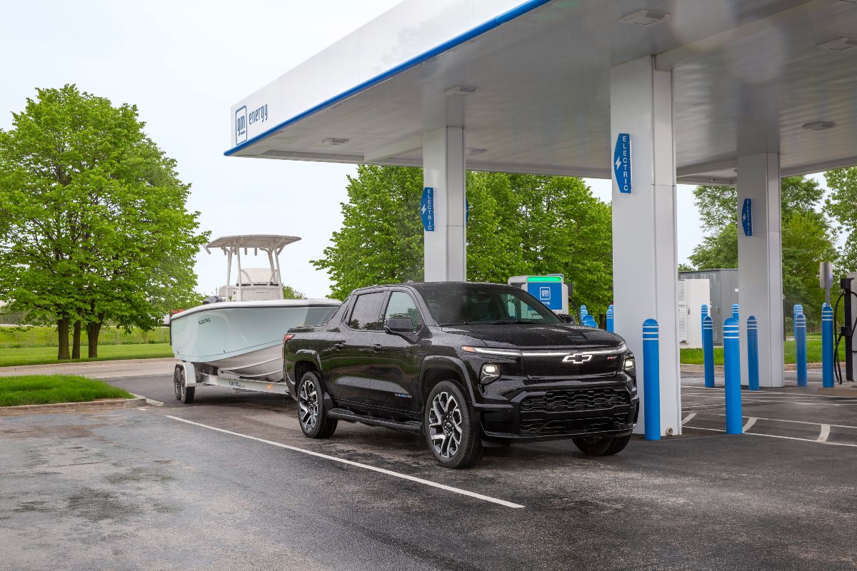 2024 Chevy Silverado EV Exterior Passenger Side Front Angle while Towing & Charging