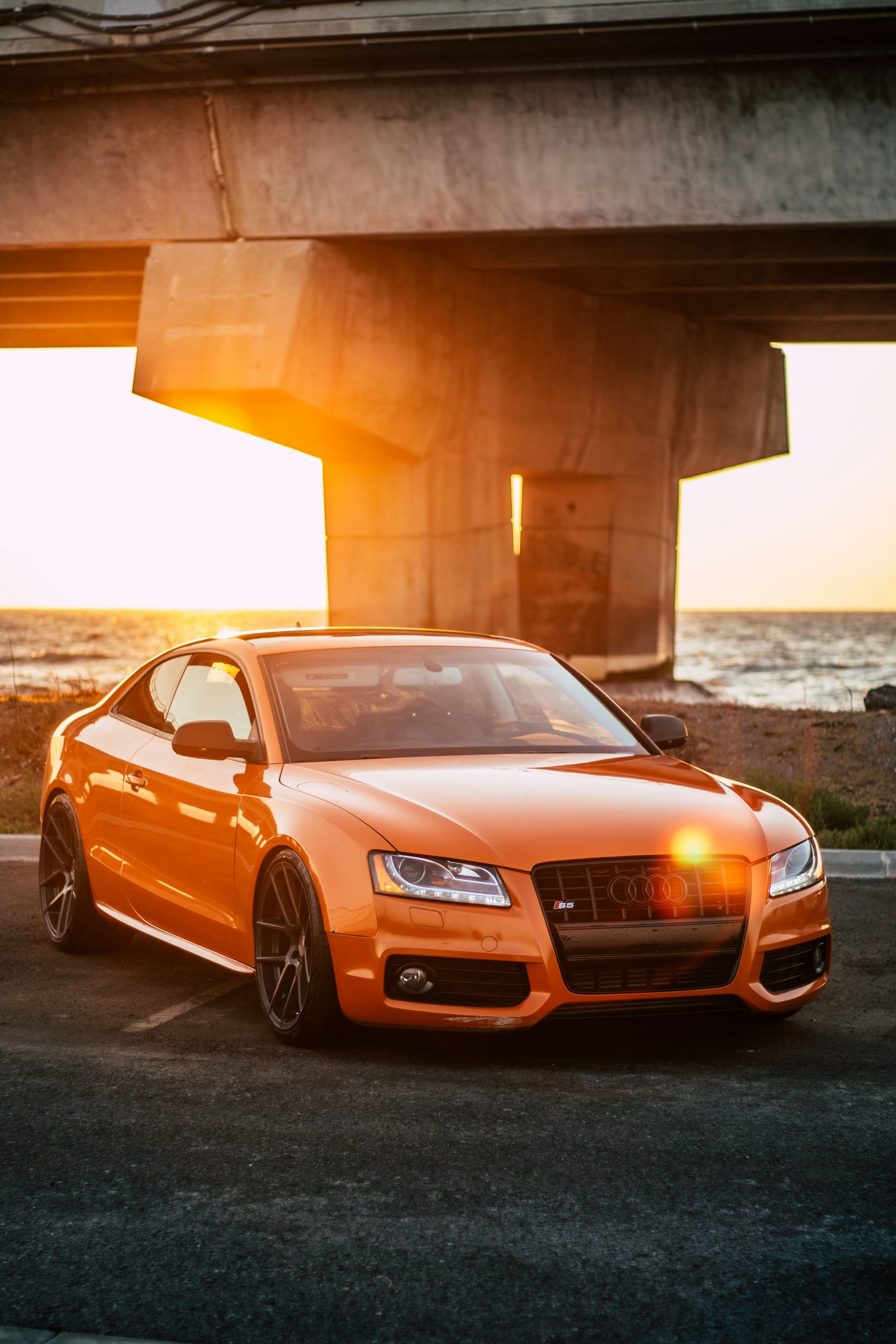 Bold front grille of a full-size sedan at dusk