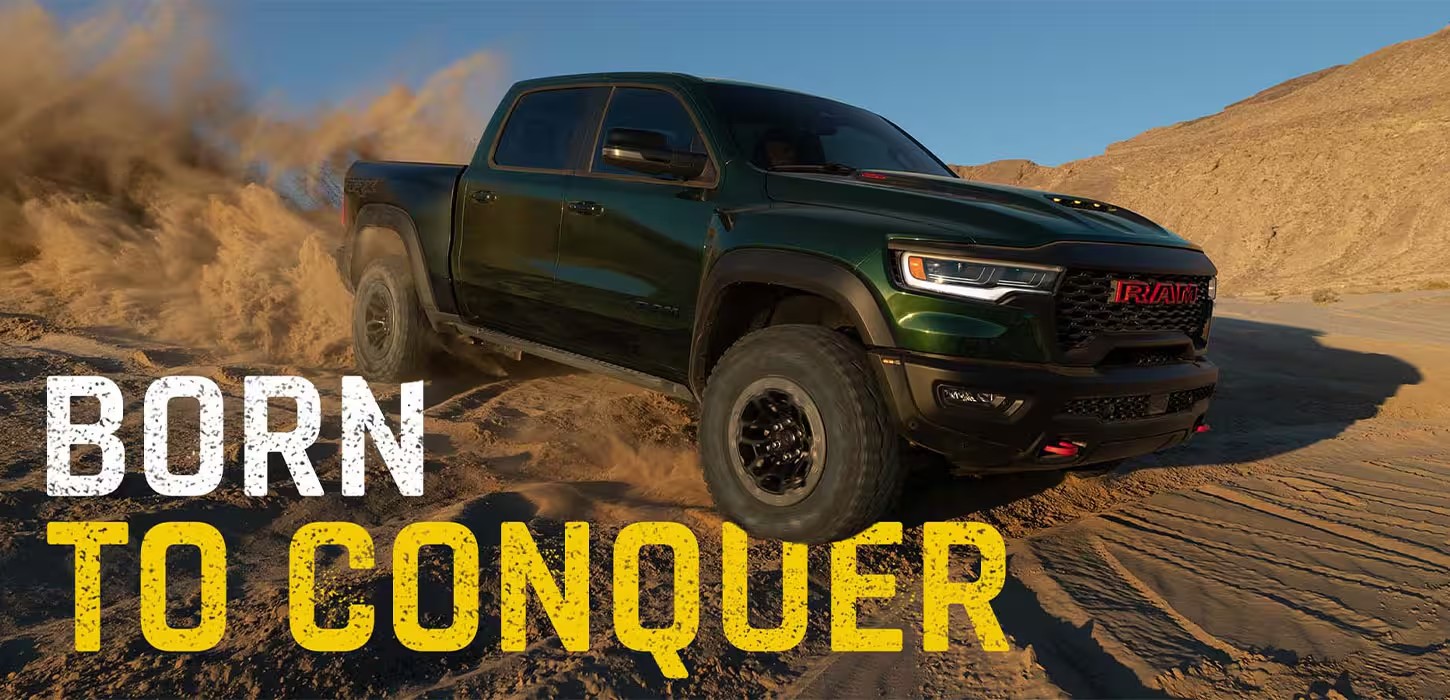 2027 Ram 1500 TRX SRT kicking up sand in the desert, available at Coastline CDJR in Orange County