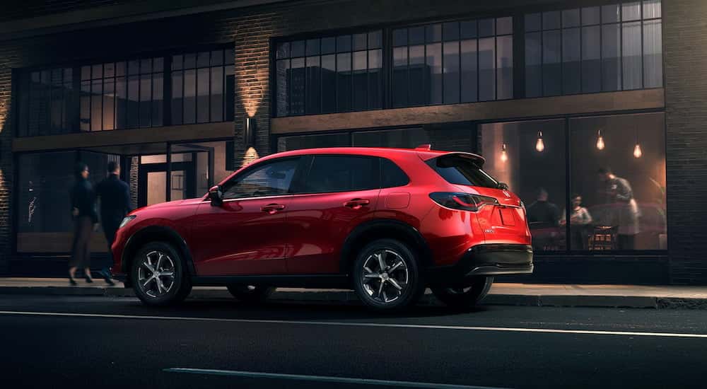 Red 2025 Honda HR-V parked by a curb