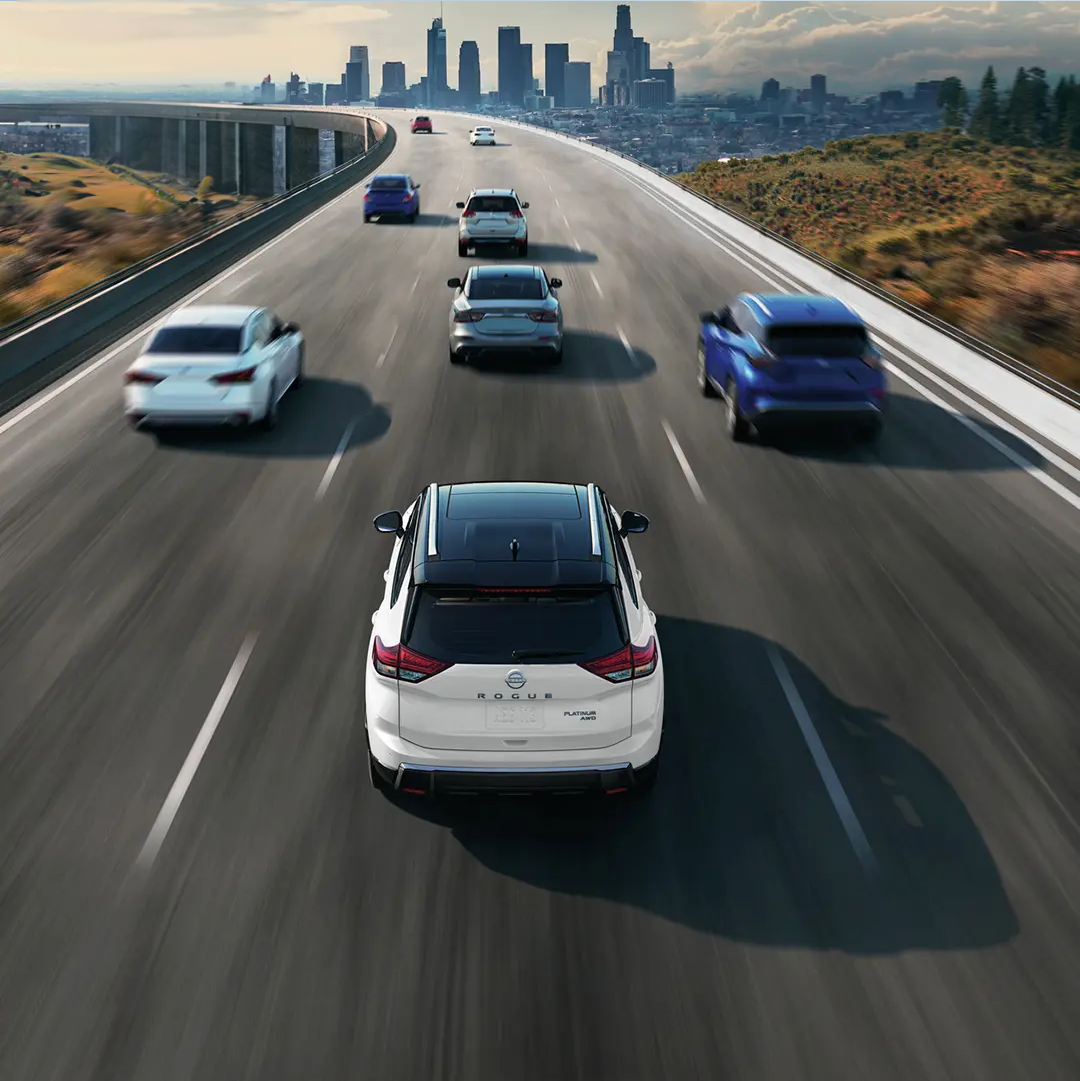 Nissan vehicles driving on a highway