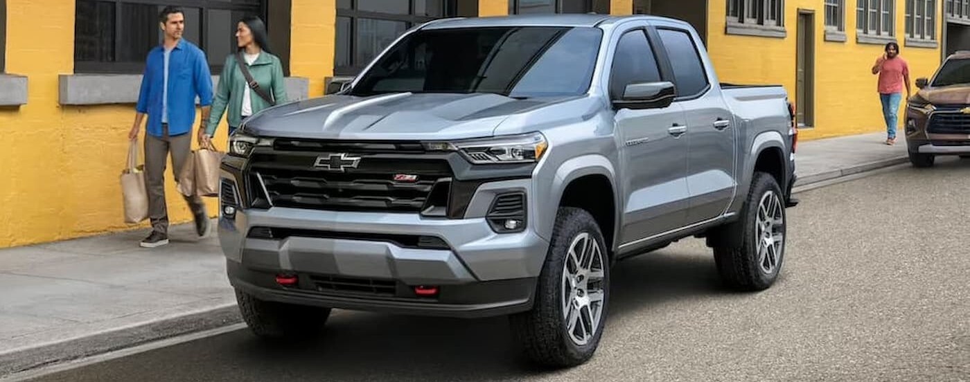 People walking near a parked 2023 Chevy Colorado Z71.