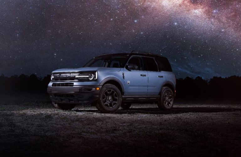 Blue 2024 Ford Bronco Sport with Black Appearance Package in a Desert at Night