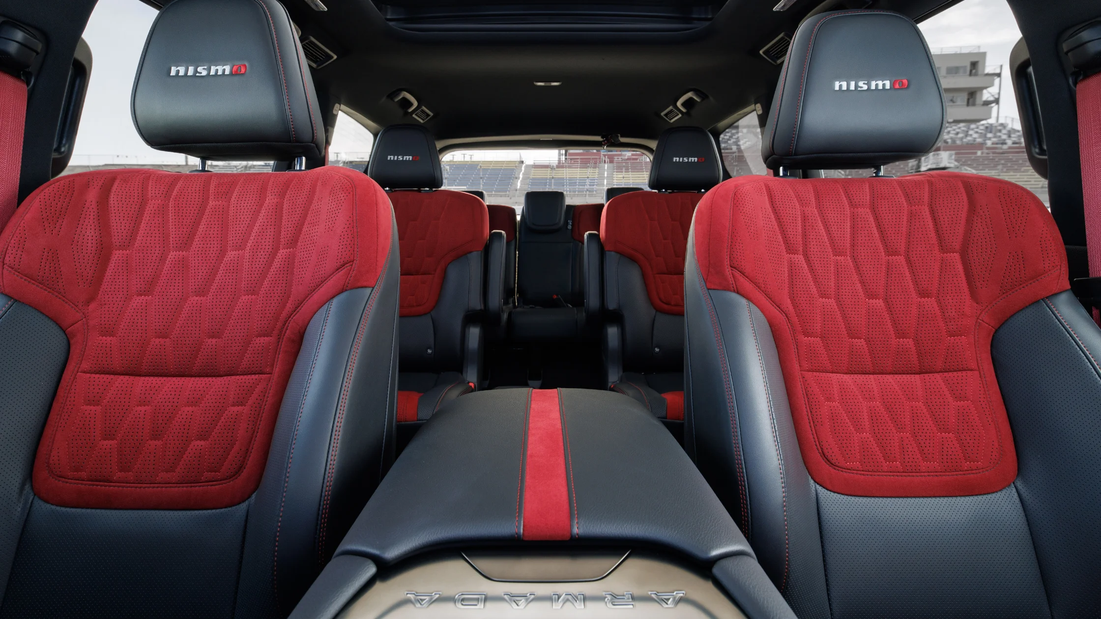 2026 Nissan Armada® NISMO front seats with red suede upholstery and black leather bolsters