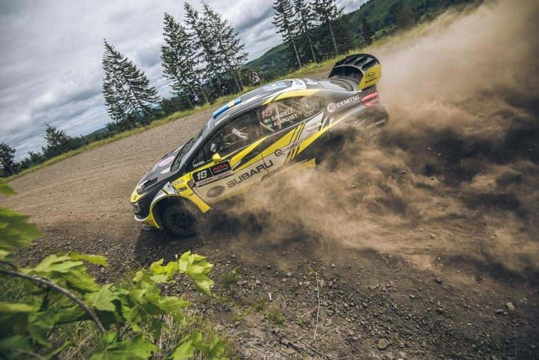 Subaru rally car drifting on a gravel stage