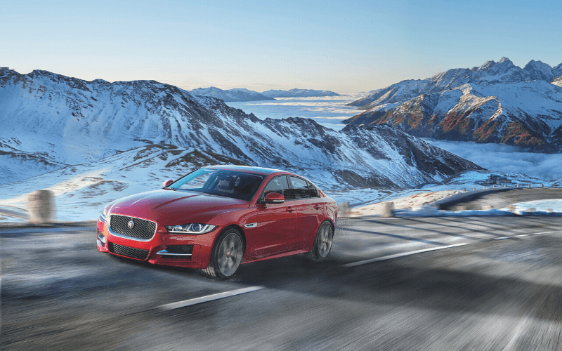 How Do EVs Perform in the Snow?-Red Car Driving In The Snow