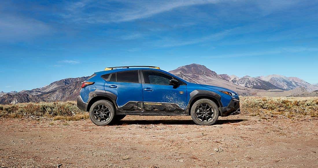Blue Subaru Crosstrek parked in the desert