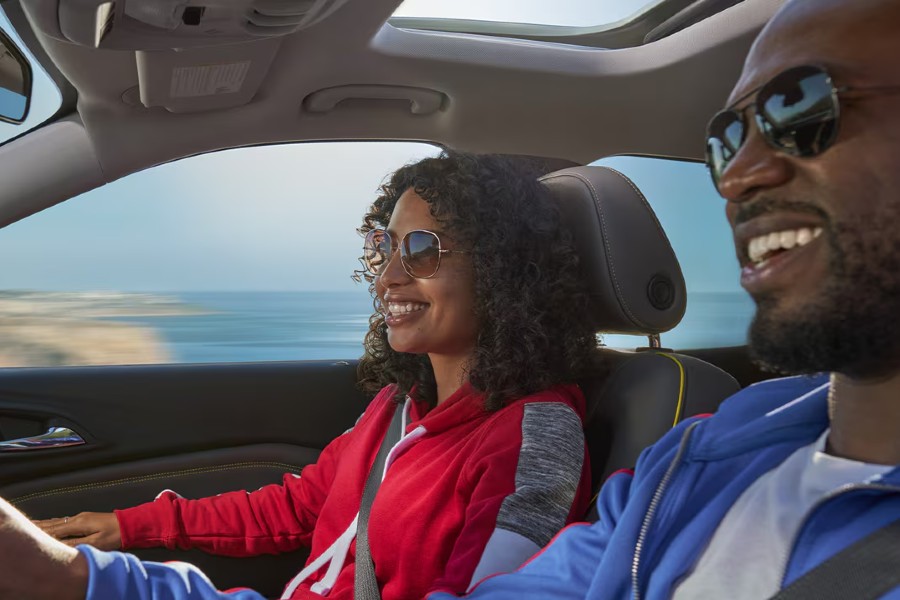 Happy Couple Driving a Chevy Vehicle