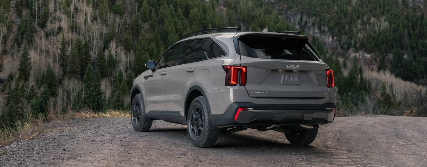 Grey 2025 Kia Sorento X-Pro SX Prestige parked on a mountain ridge