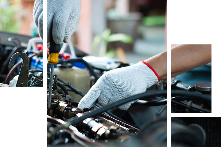 Subaru technician inspecting a vehicle in the service bay