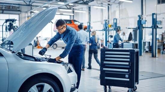 auto repair near me, mechanics working on vehicle at shop