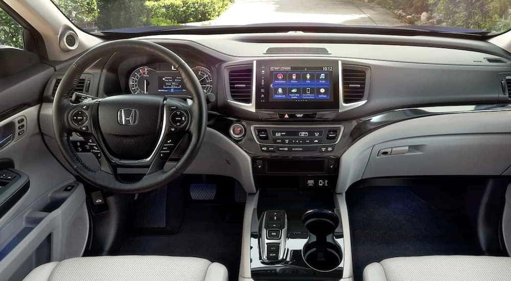 The black and white interior of a 2020 Honda Ridgeline RTL-E is shown.