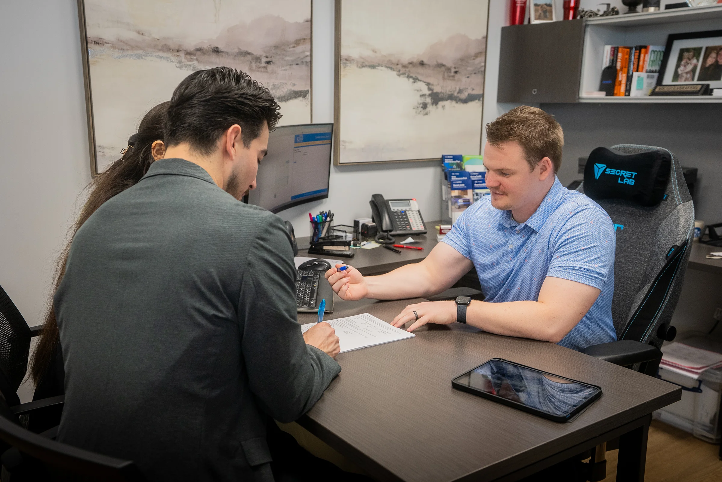 Finance manager at Don Hattan Ford assisting customers with their trade in that hasn't been paid off. Our team is the best in Wichita when it comes to make financing your vehicle easy and stree-free.