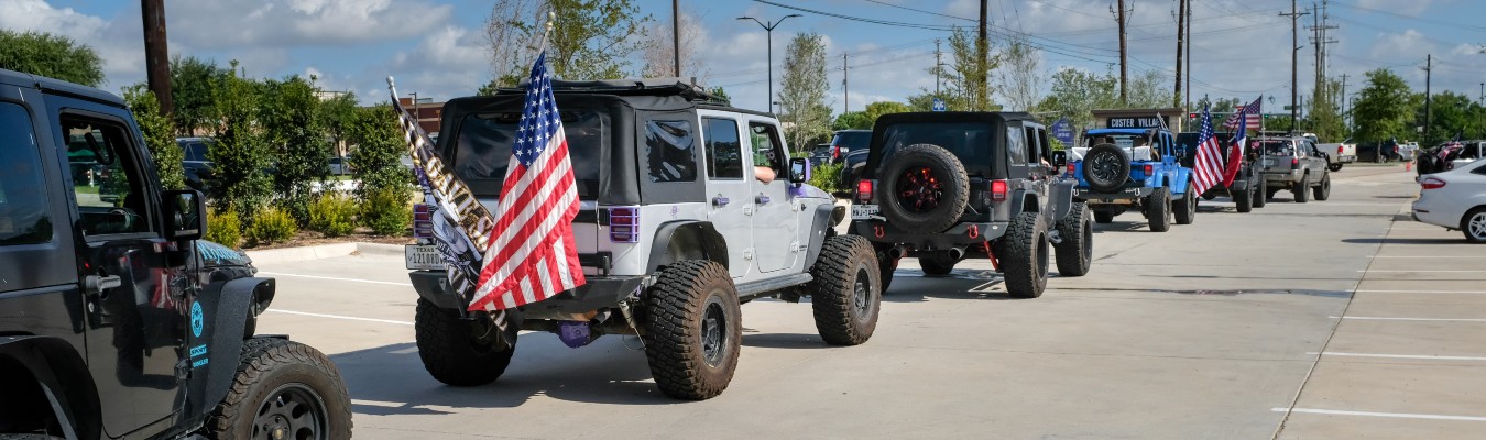 Parade of Jeep Wranglers Driving Away from Camera