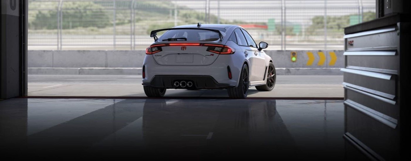 White 2024 Honda Civic Type R leaving a garage