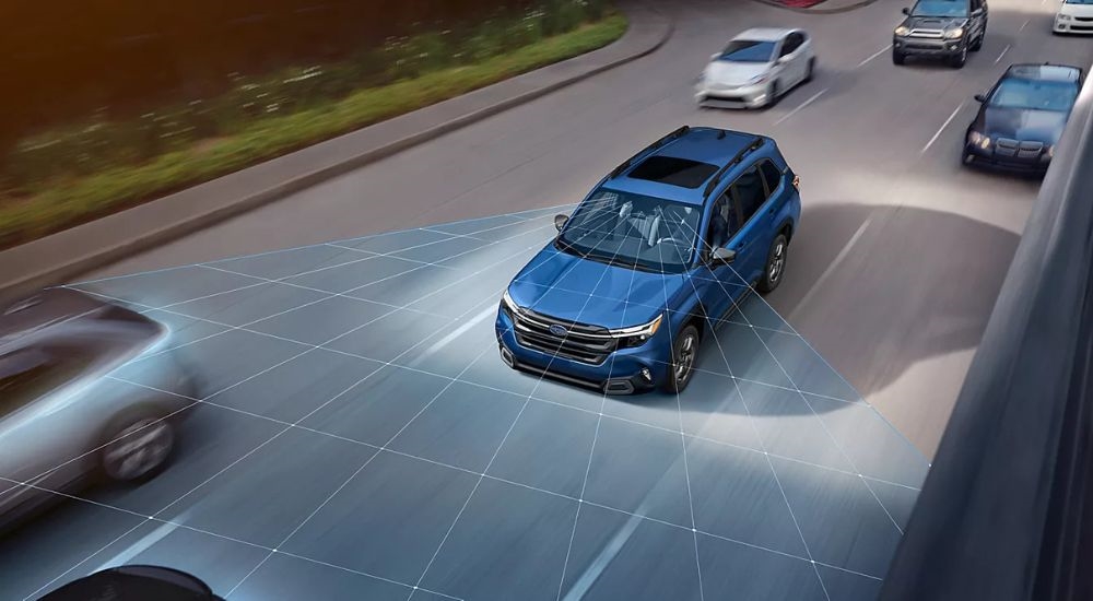 A blue 2025 Subaru Forester driving on the highway with simulated lines showing the EyeSight driver assist feature.