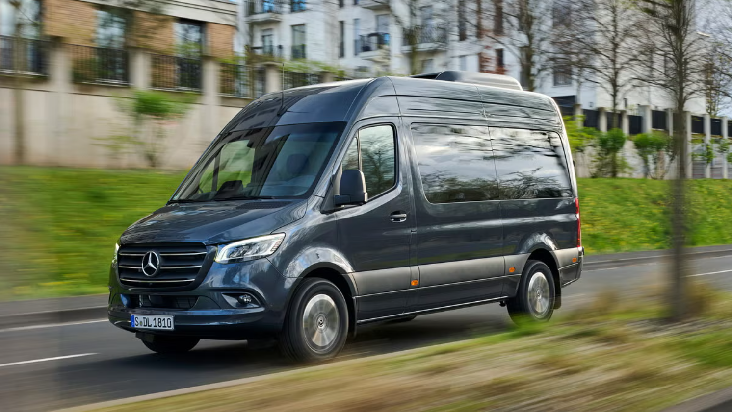 A 2026 Mercedes-Benz Sprinter van drives down the road.
