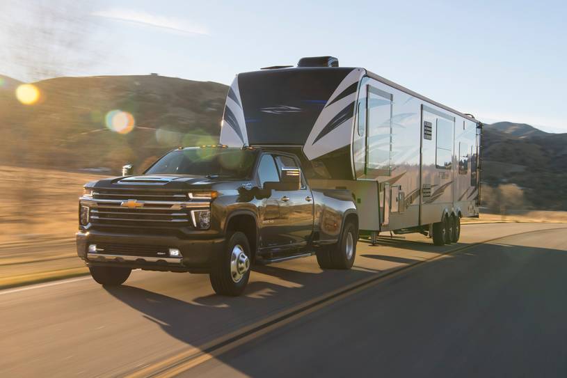 The 2022 Chevrolet Silverado 3500HD pulling a camper.