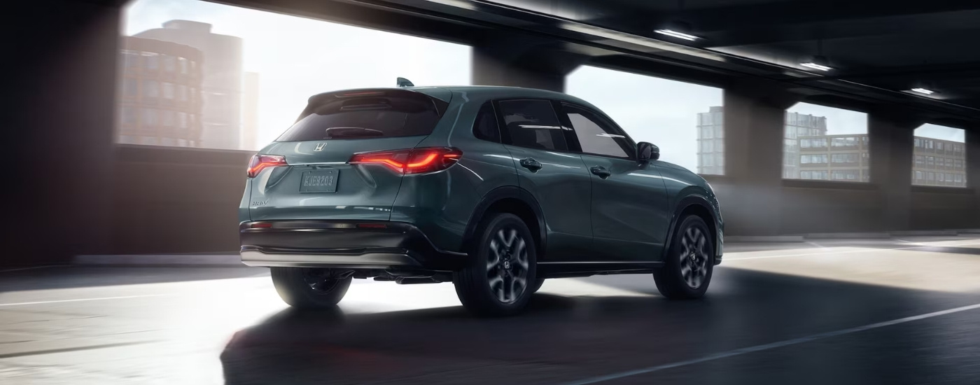 Green 2026 Honda HR-V EX-L driving through a tunnel