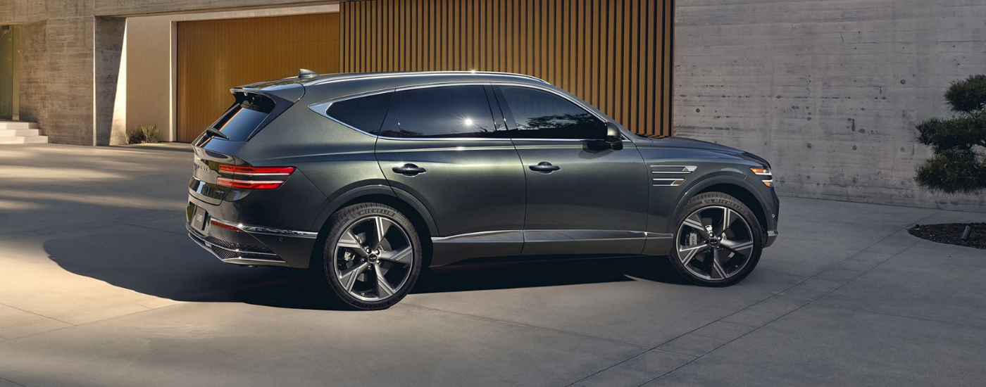 Grey 2026 Genesis GV80 parked in a driveway