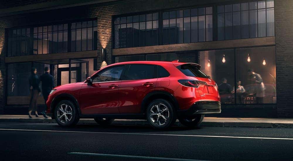 A red 2023 Honda HR-V is shown from the rear at an angle after leaving a Honda HR-V dealer.