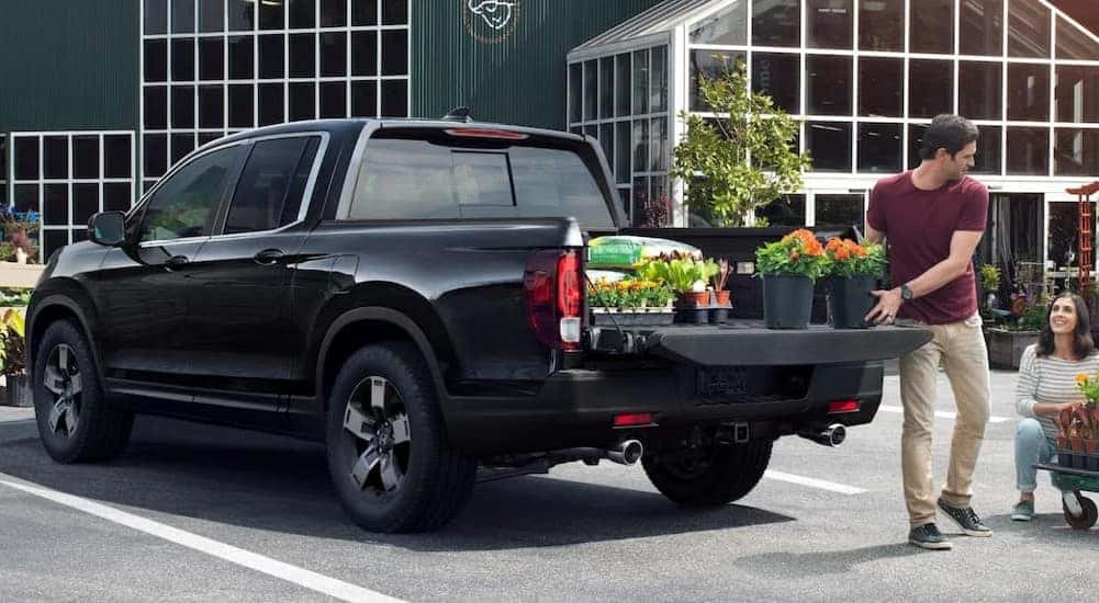A black 2025 Honda Ridgeline for sale in Rochester parked.