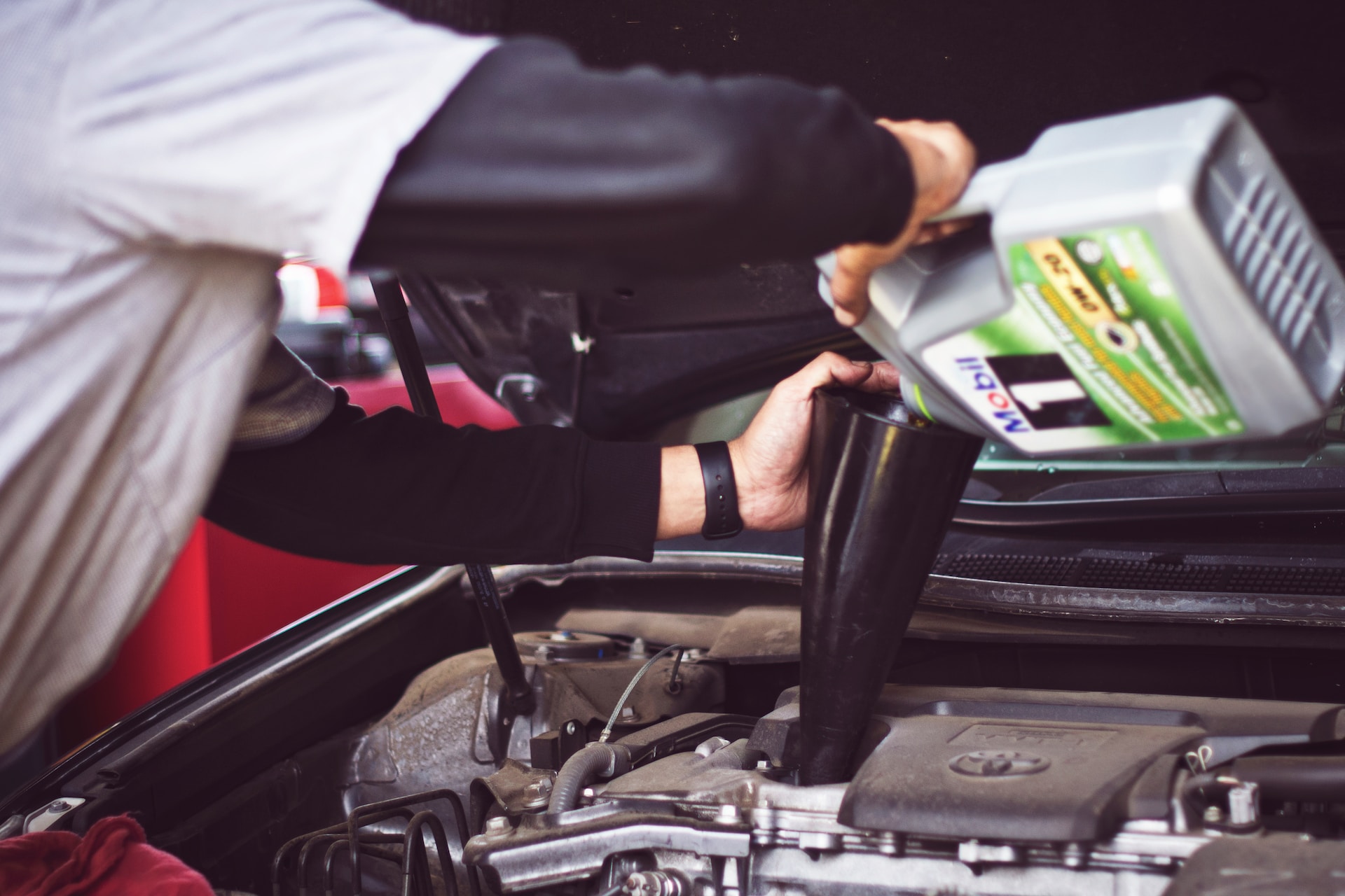 Man peforming an oil change