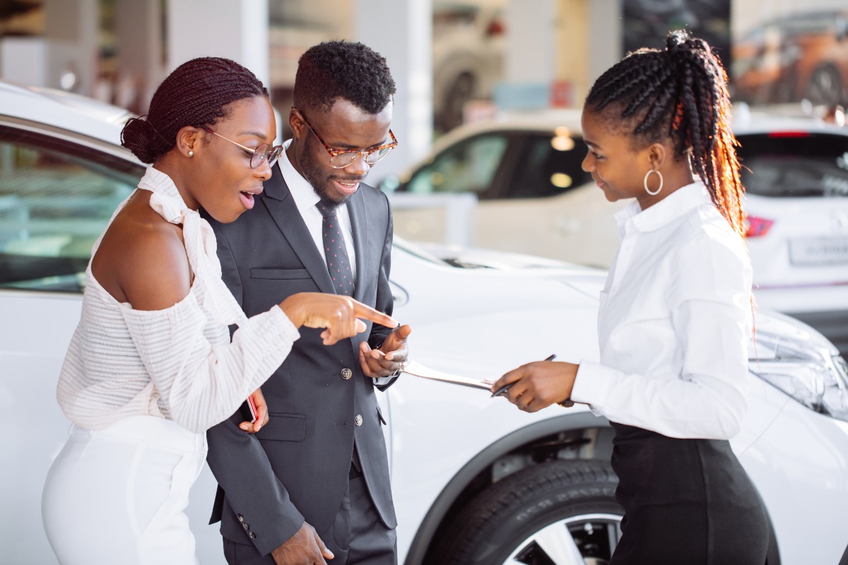 Couple Selling Car to Saleswoman