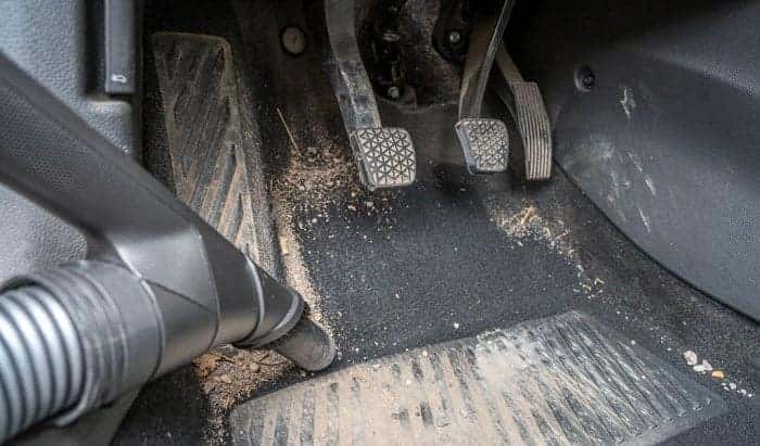Dirty car floor mats and pedals