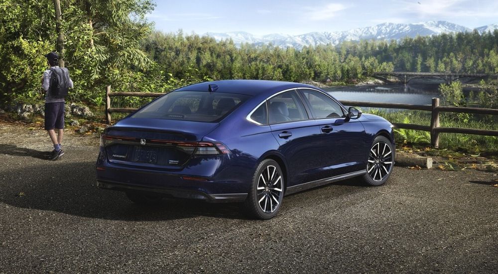 Rear view of a blue 2026 Honda Accord Touring Hybrid.