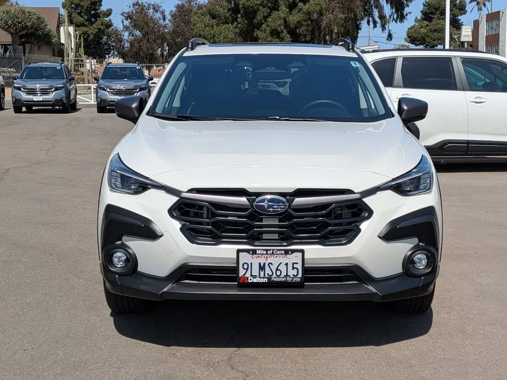 Front of a white used 2024 Subaru Crosstrek Premium on the Dalton Subaru National City used-car lot